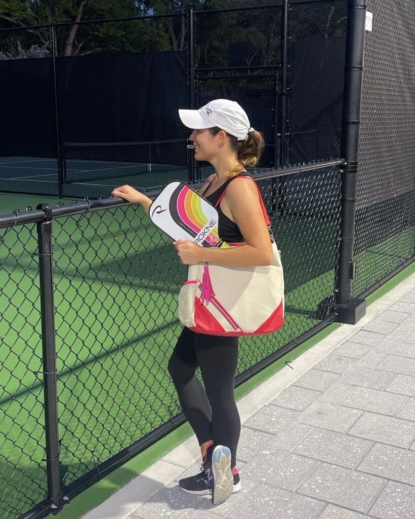 Women wearing luxury pickleball bag getting ready to play